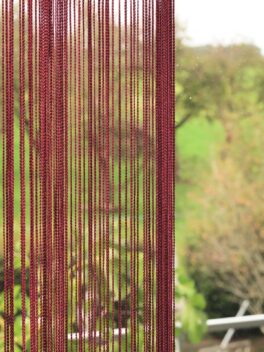 Rideau à franges ANCONA rouge conclusion à droite